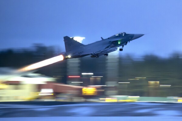 FILE - A JAS 39 Gripen C/D takes off during military exercise Nordic Response at Luleå-Kallax Airport, near Luleå, Sweden, Monday, March 4, 2024. The Swedish government said Wednesday, May 29, 2024, that it will donate military aid to Ukraine worth 13 billion kronor ($1.23 billion) in the largest help package Sweden has so far donated.(Anders Wiklund/TT News Agency via AP, File)