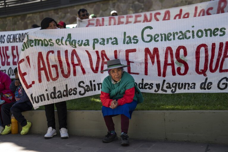 A women attends a protest against lithium extraction in indigenous communities in San Salvador de Jujuy, Argentina, Wednesday, April 26, 2023. As lithium mining has gained a greater global spotlight, the fate of water in the region has increasingly fallen out of the hands of those communities. (AP Photo/Rodrigo Abd)