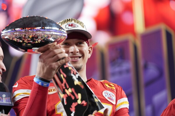 Kansas City Chiefs quarterback Patrick Mahomes holds the Vince Lombardi Trophy after the NFL Super Bowl 58 football game against the San Francisco 49ers on Sunday, Feb. 11, 2024, in Las Vegas. The Kansas City Chiefs won 25-22 against the San Francisco 49ers. (AP Photo/Ashley Landis)