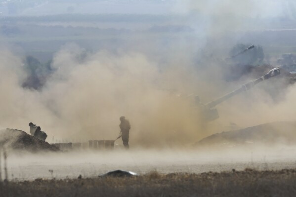 An Israeli mobile artillery unit fired a shell from southern Israel towards the Gaza Strip, in a position a near the Israel Gaza border, Israel, Wednesday, Oct. 11, 2023. (AP Photo/Erik Marmor)