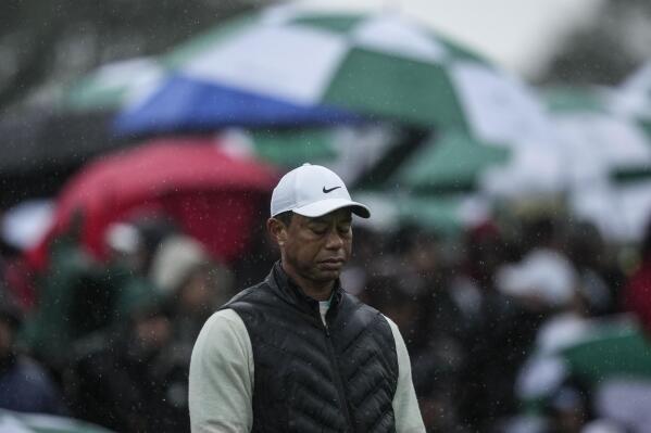 Tiger Woods walks on the 18th hole during the weather delayed second round of the Masters golf tournament at Augusta National Golf Club on Saturday, April 8, 2023, in Augusta, Ga. (AP Photo/Matt Slocum)