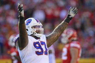 FILE - Buffalo Bills defensive tackle Jordan Phillips (97) celebrates during the first half of the team's NFL football game against the Kansas City Chiefs on Oct. 16, 2022, in Kansas City, Mo. Phillips is returning to the Bills for a second consecutive season after signing a one-year contract Thursday, April 6. (AP Photo/Reed Hoffmann, File)