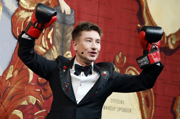 Harvard University's Hasty Pudding Theatricals Man of the Year Barry Keoghan reacts after boxing with a character named Mr. Irish Potato Famine during a roast, Friday, Feb. 2, 2024, in Cambridge, Mass. (AP Photo/Michael Dwyer)