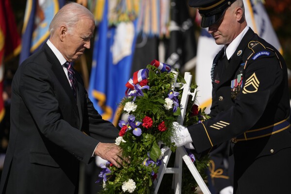 President Joe Biden lays a wreath at the Tomb of the Unknown Soldier at Arlington National Cemetery in Arlington, Va., Saturday, Nov. 11, 2023. (AP Photo/Andrew Harnik)