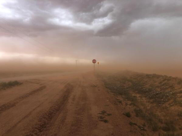 In this photo provided by Jude Smith, sand blowing off fields creates a dust storm near Morton, Texas, on May 18, 2021. The U.S. Department of Agriculture is encouraging farmers in a “Dust Bowl zone” that includes parts of Texas, New Mexico, Oklahoma, Kansas and Colorado, to preserve and establish grasslands as the area becomes increasingly dry. (Jude Smith via AP)