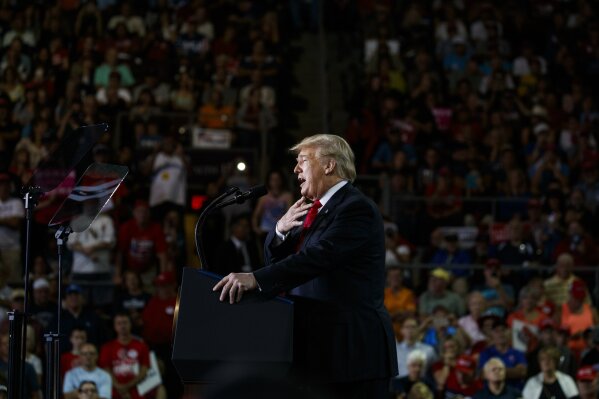 
              President Donald Trump speaks at a campaign rally at Erie Insurance Arena, Wednesday, Oct. 10, 2018, in Erie, Pa. As Hurricane Michael pounded the Southeast on Wednesday, Trump took shelter at the campaign rally in Pennsylvania, where he sought to boost Republicans before the midterms. (AP Photo/Evan Vucci)
            