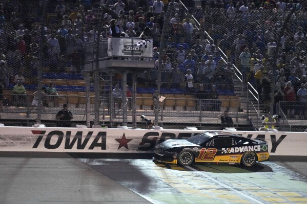 Ryan Blaney crosses the finish line as he wins a NASCAR Cup Series auto race, Sunday, June 16, 2024, at Iowa Speedway in Newton, Iowa. (AP Photo/Charlie Neibergall)