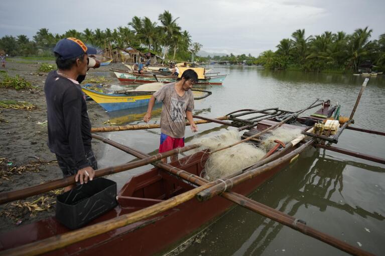 Fishermen prepare their boats at the coastal town of Tanauan, Leyte, Philippines on Wednesday, Oct. 26, 2022. Recently, the country has begun to make strides in rebuilding fisheries with spawning closures, said Mudjekeewis Santos, a scientist with the Philippines Department of Agriculture’s National Fisheries Research and Development Institute. “And the communities are happy that happened, because their catch increased,” he said. “Fish don’t care about jurisdiction, and they’re being decimated.” (AP Photo/Aaron Favila)