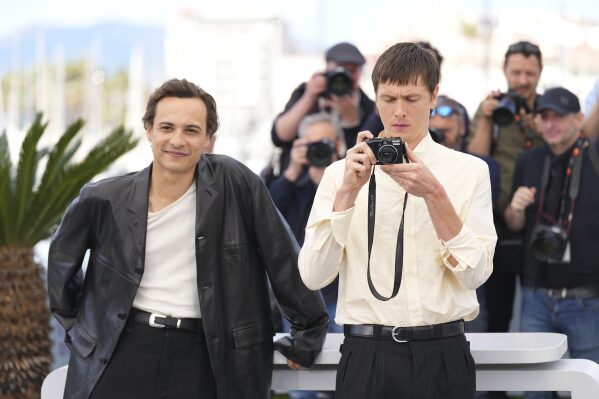 Frank Dillane, left, and Harris Dickinson posing for photographers at the photo Call for the Film 'Undin' at the 78th International Film Festival, Cannes, Southern France, Saturday, May 17, 2025. (AP Photo/Natacha Pisarenko)