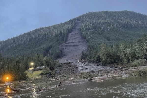 FILE - This photo provided by the Alaska Department of Public Safety shows the landslide that occurred the previous evening near Wrangell, Alaska, Tuesday, Nov. 21, 2023. Authorities recovered the body of Kara Heller, 11, Saturday evening, Nov. 25, from the debris of a landslide in southeast Alaska that tore down a wooded mountainside, smashing into the homes in a remote fishing village Monday night, Nov. 20. The girl is the fourth confirmed killed by the landslide from the Heller family. (Alaska Department of Public Safety via AP, File)