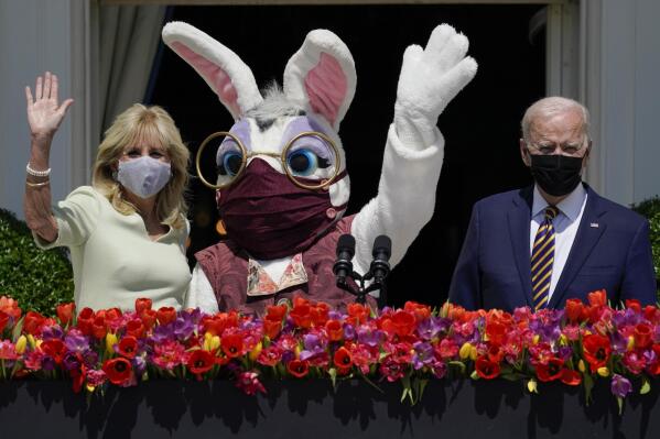 FILE - President Joe Biden appears with first lady Jill Biden and the Easter Bunny on the Blue Room balcony at the White House April 5, 2021, in Washington. The White House Easter Egg Roll is returning on April 18, 2022, after a 2-year, COVID-induced hiatus. The Biden's will welcome some 30,000 kids and their adult chaperones for the egg roll, an egg hunt and other activities. (AP Photo/Evan Vucci, File)