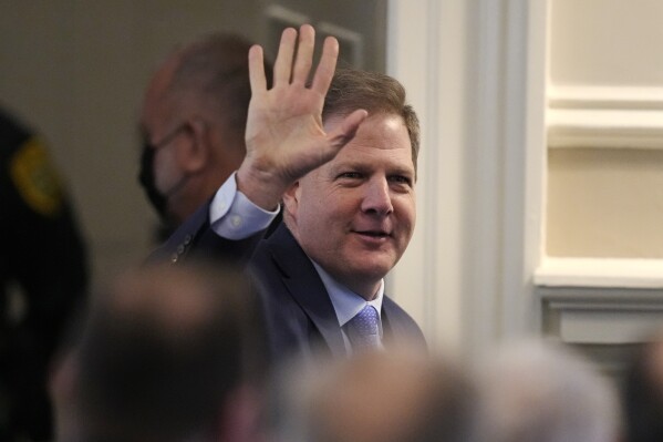 New Hampshire Governor Chris Sununu waves while being introduced prior to his State of the State address at the State House, Thursday, Feb. 15, 2024, in Concord, N.H. (AP Photo/Charles Krupa)