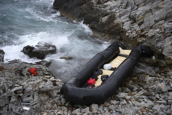 FILE - A dinghy lies on the shore after a shipwreck where two migrants were killed and eight were rescued, in Thermi, on the northeastern Aegean Sea island of Lesbos, Greece, on Wednesday, Jan. 10, 2023. The U.N. migration agency reported Wednesday that 8,565 people died on land and sea routes worldwide last year, a record high since launching its tally of the death toll a decade ago. The International Organization for Migration says the biggest increase in deaths last year came in the treacherous Mediterranean sea crossing. (AP Photo/Panagiotis Balaskas, File)