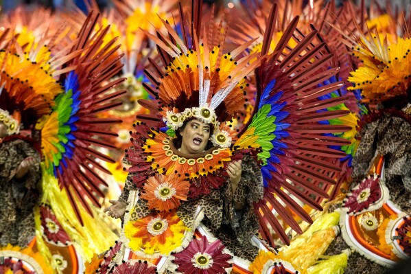 A dancer from the Tom Maior samba school performs during a Carnival parade in Sao Paulo, Brazil, early Sunday, Feb. 11, 2024. (APPhoto/Andre Penner)