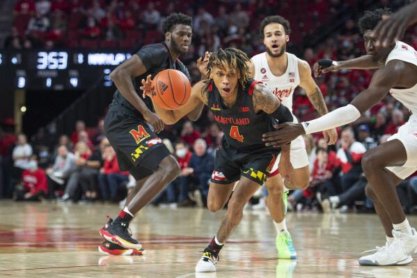Maryland's Fatts Russell (4) drives with the ball during the first half of the team's NCAA college basketball game against Nebraska on Friday, Feb. 18, 2022, in Lincoln, Neb. (Jaiden Tripi/Lincoln Journal Star via AP)