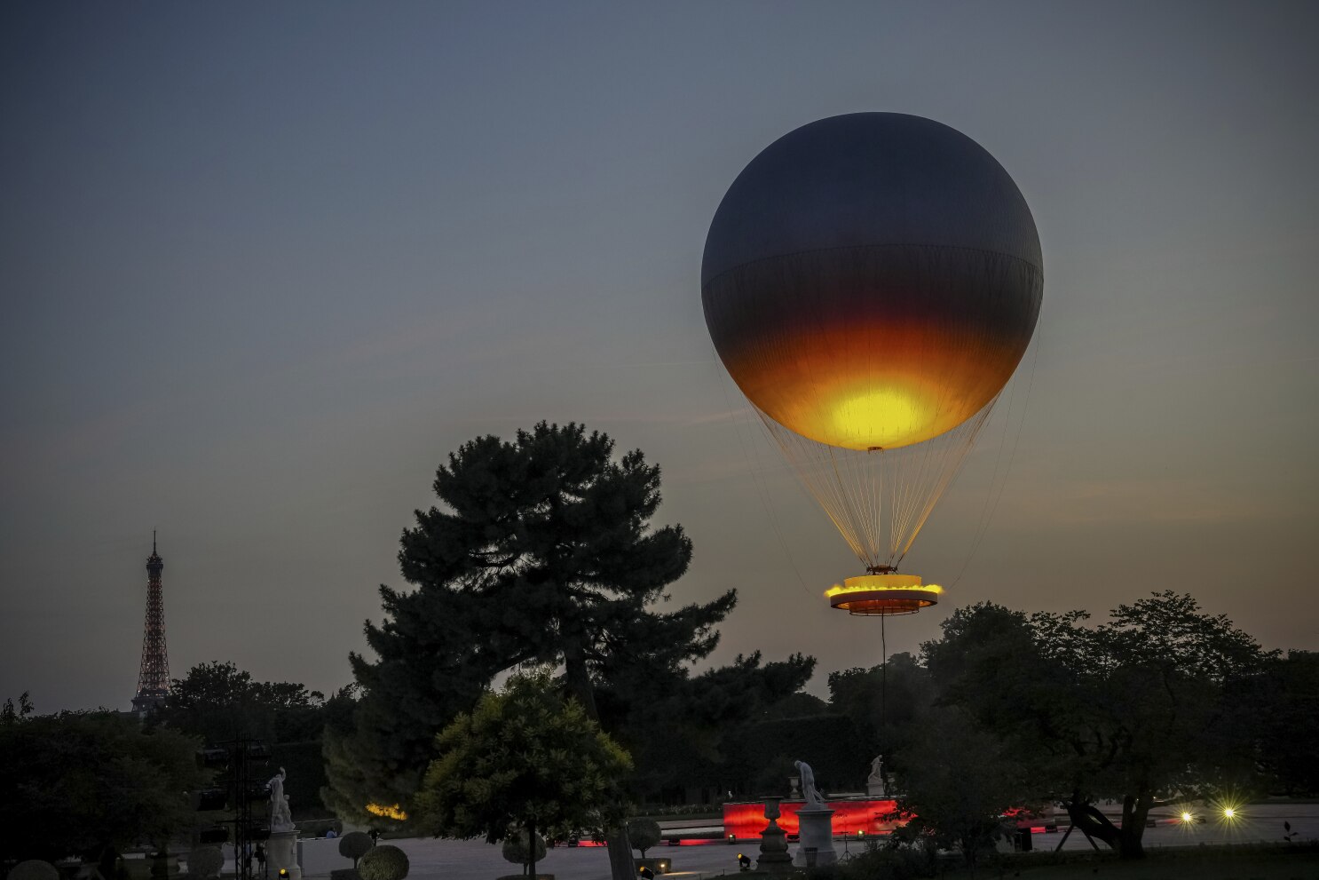 Paris' iconic cauldron from the Olympic Games returns to light up summer nights