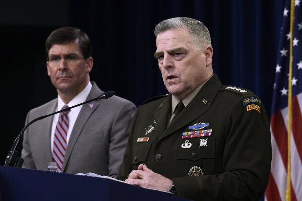 Defense Secretary Mark Esper, left, and Chairman of the Joint Chiefs of Staff Army Gen. Mark Milley, right, during a briefing at the Pentagon in Washington, Monday, March 2, 2020. (AP Photo/Susan Walsh)