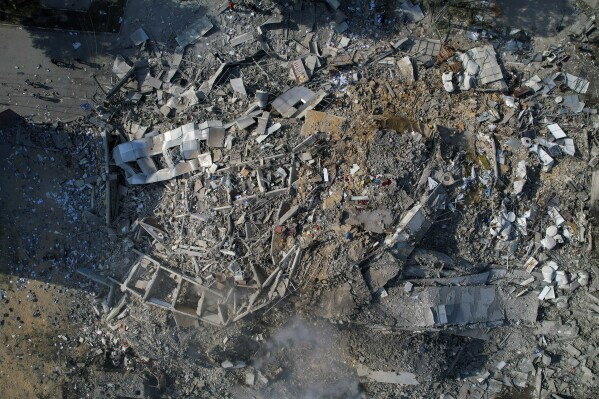 FILE - View of the debris of a building after an Israeli airstrike in Gaza City on October 8, 2023.  After an 11-week war in Gaza, the Israeli military campaign against Hamas is now the deadliest and most destructive in history.  The Palestinian death toll is approaching 20,000 and satellite data shows a third of the structures in the small area have been destroyed.  (AP Photo/Hatem Moussa, File)