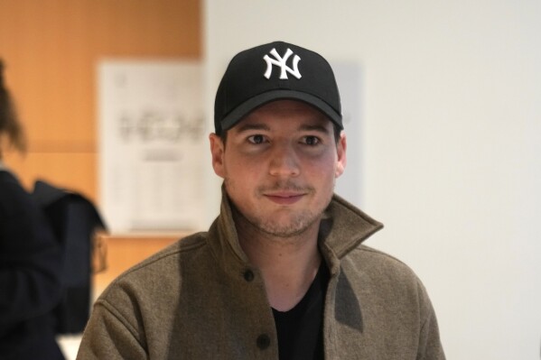 Rui Pinto, a Portuguese hacker whose bombshell revelations on the "Football Leaks" website which rocked European soccer , arrives at the Paris court room, Wednesday, Nov. 22, 2023 in Paris. Pinto goes on trial for hacking documents from the PSG soccer team. (AP Photo/Michel Euler)