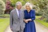 Britain's King Charles III and Queen Camilla stand in Buckingham Palace Gardens on Wednesday April 10, 2024, the day after their 19th wedding anniversary. This photo is being released on Friday, April 26, 2024, to mark the first anniversary of their Coronation. Buckingham Palace says King Charles III will resume his public duties next week following treatment for cancer. The announcement on Friday April 26, 2024, comes almost three months after Charles took a break from public appearances to focus on his treatment for an undisclosed type of cancer. (Millie Pilkington/Buckingham Palace via AP)
