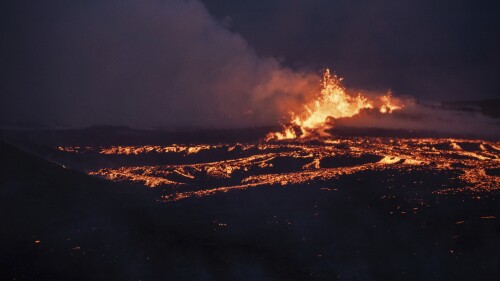 Lava emerges from a fissure of the Fagradalsfjall volcano near the Litli-Hrútur mountain, some 30 kilometers (19 miles) southwest of Reykjavik, Iceland, Monday July 10, 2023. Authorities in Iceland on Tuesday warned spectators to stay away from a newly erupting volcano that is spewing lava and noxious gases from a fissure in the country’s southwest. (AP Photo/Marco Di Marco)