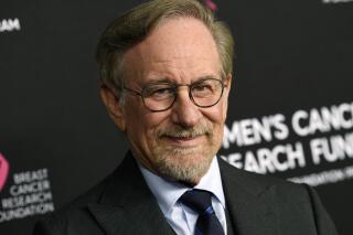 FILE - Filmmaker Steven Spielberg poses at the 2019 "An Unforgettable Evening" benefiting the Women's Cancer Research Fund in Beverly Hills, Calif. on Feb. 28, 2019. Spielberg has set a new deal with Netflix in which his production company, Amblin Partners, will make multiple feature films per year for the streaming giant. (Photo by Chris Pizzello/Invision/AP, File)