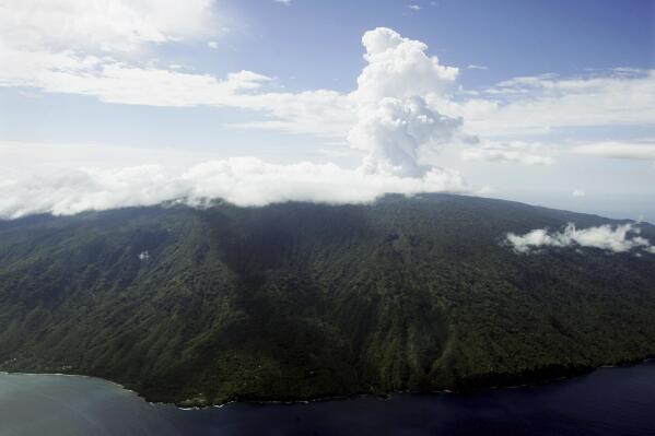 FILE - Steam billows from Lake Vui in the volcano crater of Mount Manaro on the island of Ambae, part of the Vanuatu islands chain, Dec. 8, 2005. A 7.7 magnitude earthquake Friday, May 19, 2023, in the far Pacific created small tsunami waves in Vanuatu. (AP Photo/Rick Rycroft)
