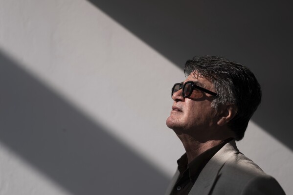 Director Jafar Panahi poses for a portrait photograph for the film 'It Was Just an Accident' at the 78th international film festival, Cannes, southern France, Wednesday, May 21, 2025. (Photo by Scott A Garfitt/Invision/AP)