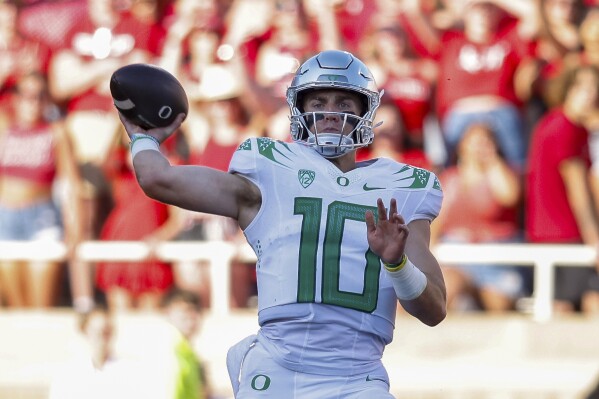 Oregon quarterback Bo Nix passes against Texas Tech during the first half of an NCAA college football game, Saturday, Sept. 9, 2023, in Lubbock, Texas. (AP Photo/Chase Seabolt)