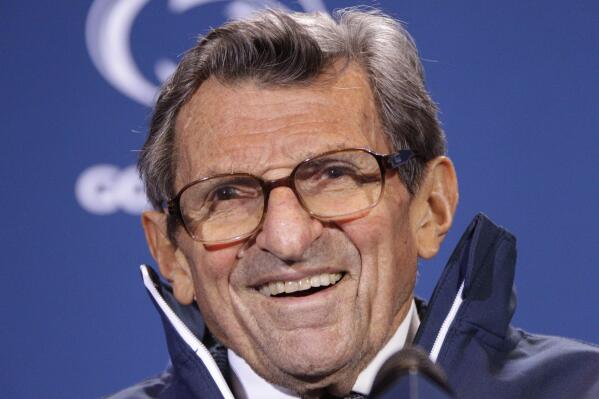 FILE - In this Oct. 29, 2011, file photo, Penn State head coach Joe Paterno smiles as he talks with reporters after recording his 409th career coaching victory, a 10-7 win over Illinois, during a a post-game NCAA college football news conference in State College, Pa.  A proposed settlement, announced Friday, Jan. 16, 2015, by the NCAA, will give Penn State back 112 football team wins that were vacated two years ago in the Jerry Sandusky child molestation scandal.  If approved, the new agreement also would restore former coach Paterno's status as the winningest coach in major college football history with 409 victories.  (AP Photo/Gene J. Puskar, File)