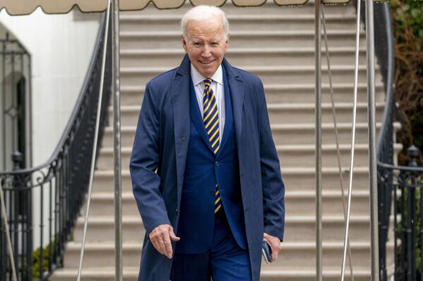 President Joe Biden walks to reporters on the South Lawn of the White House before boarding Marine One in Washington, Tuesday, Jan. 31, 2023, for a short trip to Andrews Air Force Base, Md., and then on to New York. (AP Photo/Andrew Harnik)