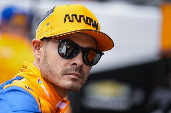 Kyle Larson waits for the start of practice for the Indianapolis 500 auto race at Indianapolis Motor Speedway in Indianapolis, Wednesday, May 15, 2024. (AP Photo/Michael Conroy)