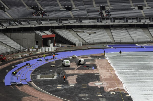 Fans get a new track color and maybe record-breaking times at Paris Olympics  | AP News