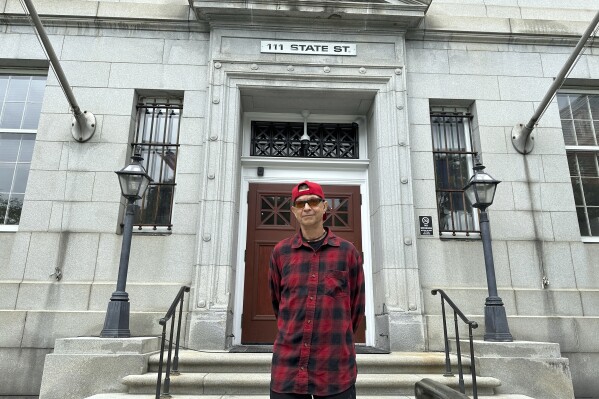 Ivo Skoric stands outside the Vermont Supreme Court building in Montpelier, Vt., Wednesday, May 29, 2024, after justices heard his appeal. Skoric, 59, representing himself, argued that he should not be denied unemployment benefits after he said he was fired from his job for misconduct after a random drug test showed he used medical marijuana off-duty. (AP Photo/Lisa Rathke)