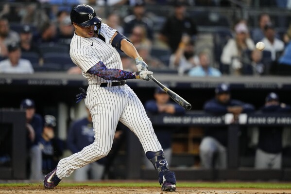 New York Yankees' Giancarlo Stanton hits a three-run home run during the third inning of a baseball game against the Tampa Bay Rays, Wednesday, Aug. 2, 2023, in New York. (AP Photo/Frank Franklin II)