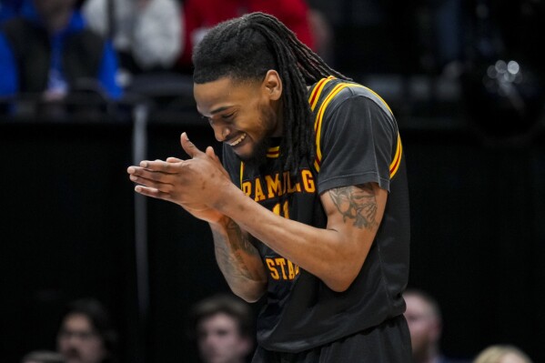 Grambling State guard Jourdan Smith claps during a stop in play in overtime of the team's First Four game against Montana State in the NCAA men's college basketball tournament Wednesday, March 20, 2024, in Dayton, Ohio. (AP Photo/Aaron Doster)