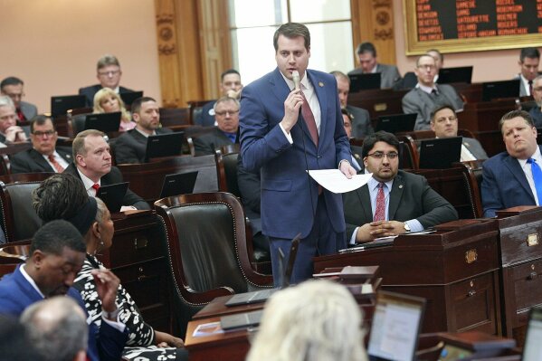 FILE - Ohio Rep. Derek Merrin stands while he advocates a yes vote on the Heartbeat Bill at the Ohio Statehouse in Columbus, Ohio on Wednesday, April 10, 2019. Since last year, GOP candidates for Ohio’s 9th Congressional District have left and entered the field on a dime, endorsements have hopped from campaign to campaign, and several big-name Republicans have split their loyalties three ways. (Brooke LaValley/The Columbus Dispatch via AP)