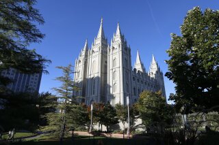 FILE - In this Oct. 5, 2019, file photo, The Salt Lake Temple stands at Temple Square in Salt Lake City. The Church of Jesus Christ of Latter-day Saints added new language to the faith's handbook Friday, Dec. 18, 2020, imploring members to root out prejudice and racism, adding significance and permanence to recent comments by top leaders on one of the most sensitive topics in the church's history. (AP Photo/Rick Bowmer, File)