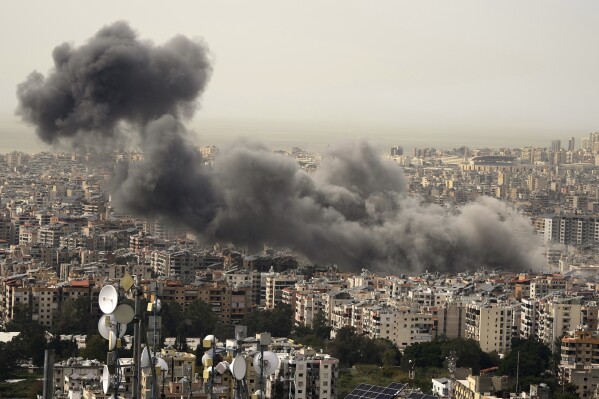 Smoke rises following an Israeli airstrike on Dahiyeh, in the southern suburb of Beirut, Lebanon, Friday, March 28, 2025. (AP Photo/Hassan Ammar)