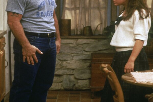 This image provided by Sony Pictures Television shows Tony Danza, left, as Tony Micelli and Alyssa Milano as Samantha Micelli in a scene from "Who's The Boss." A sequel to the 1980s-'90s sitcom is in the works at Sony Pictures Television, with Danza and Milano set to reprise their father-daughter roles. (Sony Pictures Television via AP)