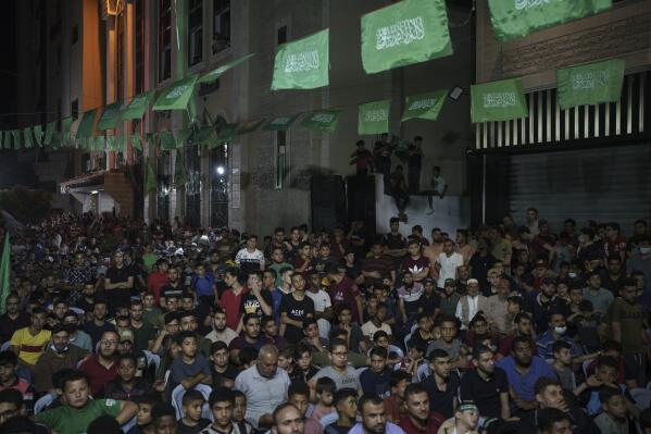 Palestinians gather during a Hamas rally in Gaza City, Wednesday, June 9, 2021. Hamas militants held a rally to commemorate the members of the group who were killed in an 11-day war with Israel in May. (AP Photo/Felipe Dana)