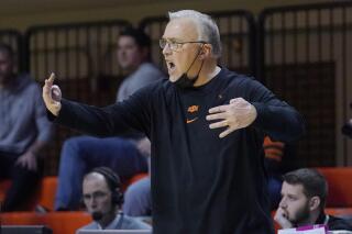 Oklahoma State head coach Jim Littell shouts in the second half of an NCAA college basketball game against Baylor, Wednesday, Feb. 23, 2022, in Stillwater, Okla. (AP Photo/Sue Ogrocki)