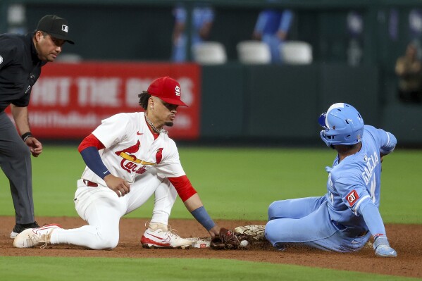 St. Louis Cardinals' Masyn Winn is late with the tag as Kansas City Royals' Maikel Garcia safely steals second during the ninth inning in the second game of a baseball doubleheader Thursday, June 5, 2025, in St. Louis. (AP Photo/Scott Kane)