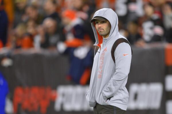 Cleveland Browns quarterback Baker Mayfield watches players warm up for an NFL football game against the Denver Broncos, Thursday, Oct. 21, 2021, in Cleveland. (AP Photo/David Richard)