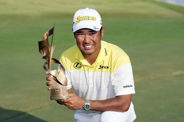 Hideki Matsuyama, of Japan, holds his trophy after winning the St. Jude Championship golf tournament Sunday, Aug. 18, 2024, in Memphis, Tenn. (AP Photo/Mark Humphrey)