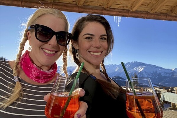 This undated image provided by Sanna Rameau, shows Ana Maria Knezevich, right, and Rameau. Spanish police are searching for Knezevich, a Colombian-American woman who went missing suddenly in Madrid. (Sanna Rameau via AP)