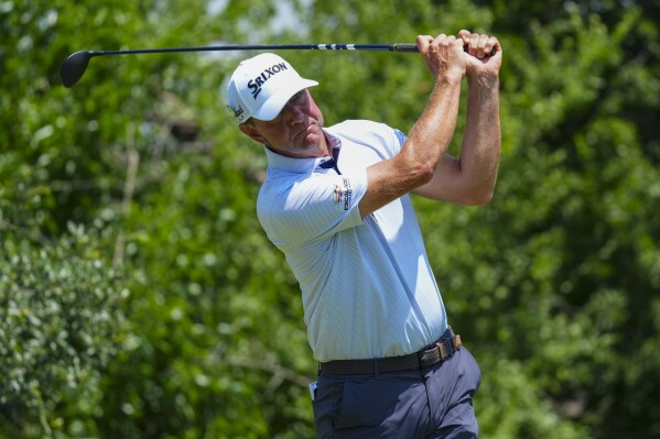 Lucas Glover hits off the ninth tee during the first round of the Charles Schwab Challenge golf tournament at Colonial Country Club in Fort Worth, Texas, Thursday, May 22, 2025. (AP Photo/LM Otero)