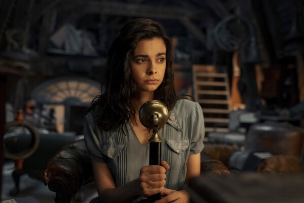 This image released by Netflix shows Aria Mia Loberti as Marie-Laure in a scene from "All the Light We Cannot See." (Katalin Vermes/Netflix via AP)