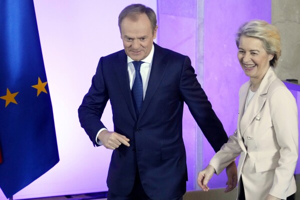 Poland's Prime Minister Donald Tusk, left, welcomes European Commission President Ursula von der Leyen, for talks about progress that Poland's new government has been making in restoring rule-of-law principles as it seeks to have its EU funds unfrozen, in Warsaw, Poland, Friday Feb. 23, 2024. (AP Photo/Czarek Sokolowski)