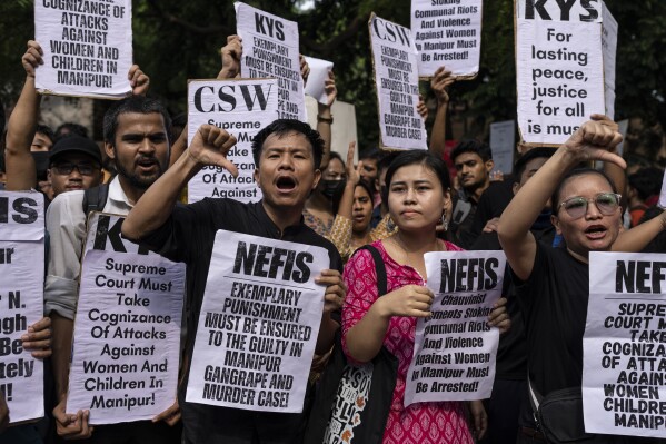 Students and activists shout slogans during a protest demonstration against the violence in the northeastern Indian state of Manipur, in New Delhi, India, Friday, July, 21, 2023. Deadly ethnic clashes in India's northeast rocked India's Parliament with the opposition blocking proceedings for a second straight day on Friday demanding the sacking of the top elected official of northeastern Manipur state where ethnic clashes have left more than 130 people dead since early May. (AP Photo/Altaf Qadri)